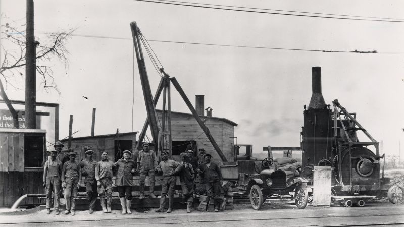 black and white photo of construction workers in 1923