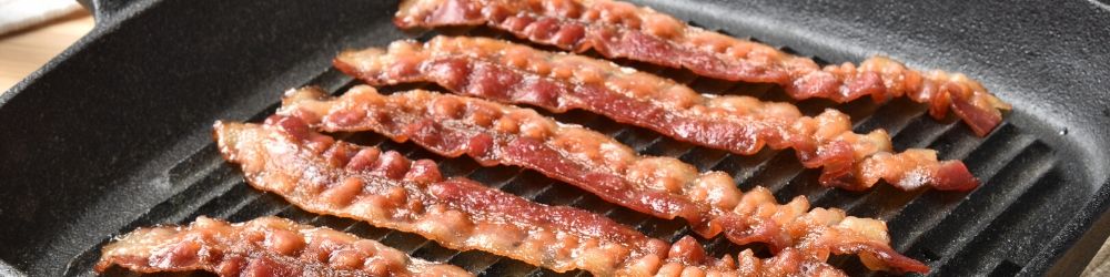 bacon frying in pan